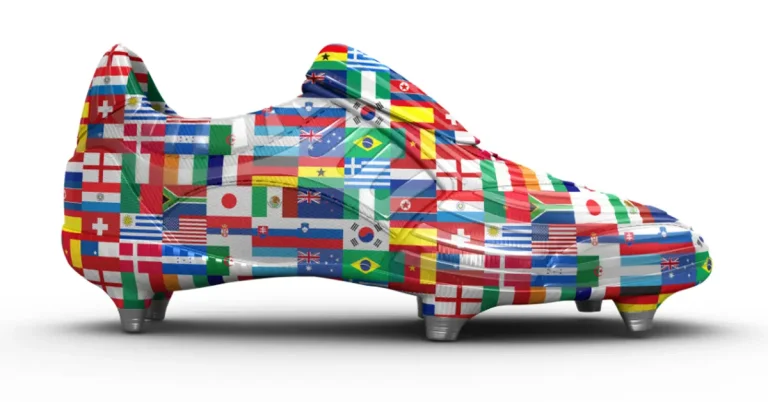 A football boot emblazoned with all the national flags of the countries competing in the world cup.